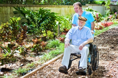 caregiver taking his patient for a walk