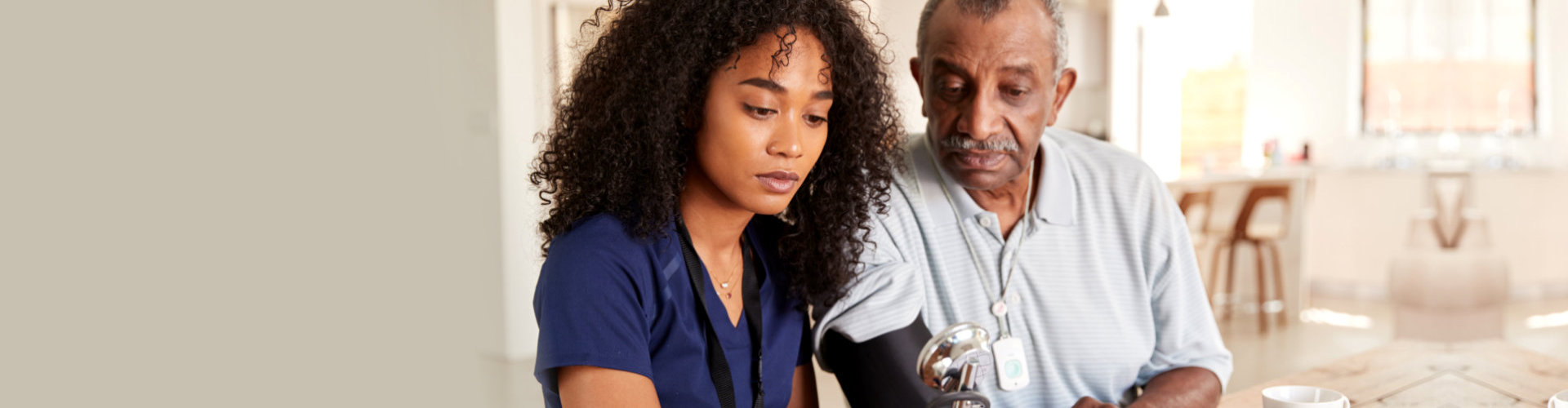 nurse talking to senior man indoor